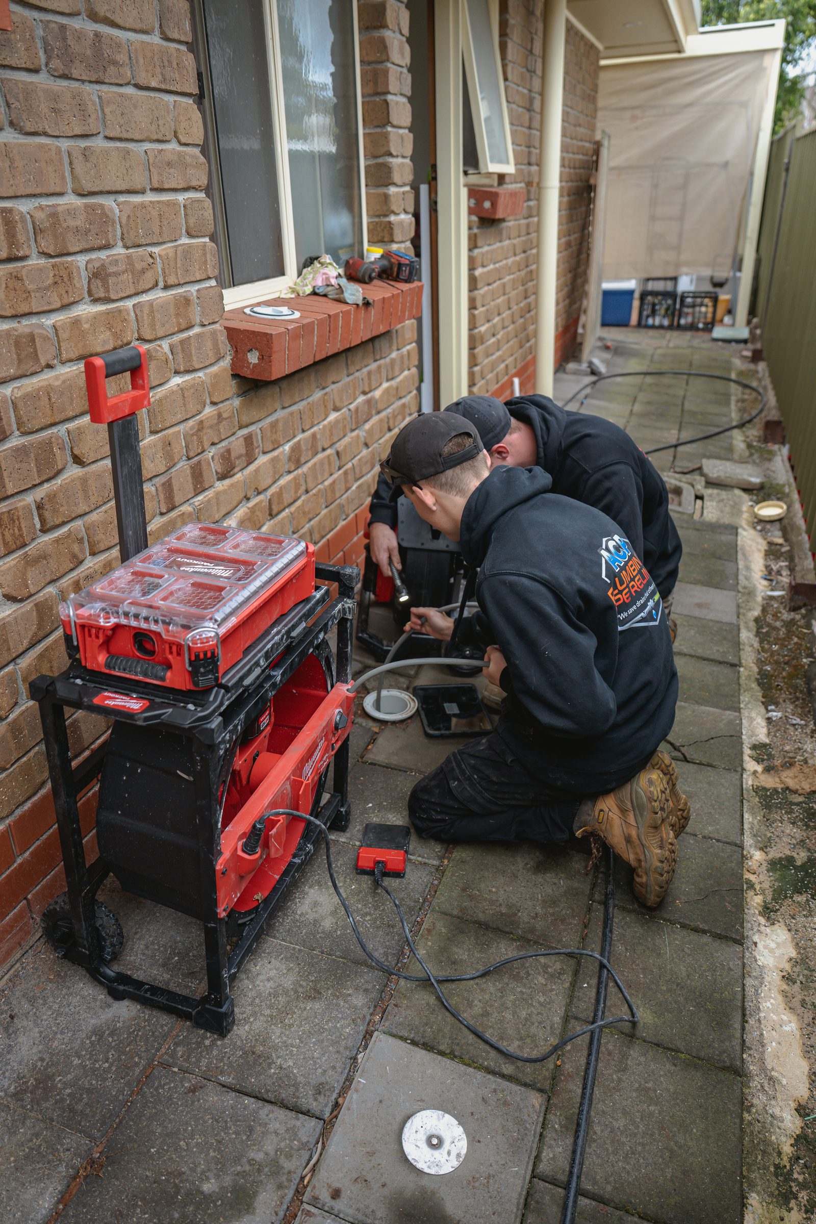 ACP technician running a CCTV drain camera